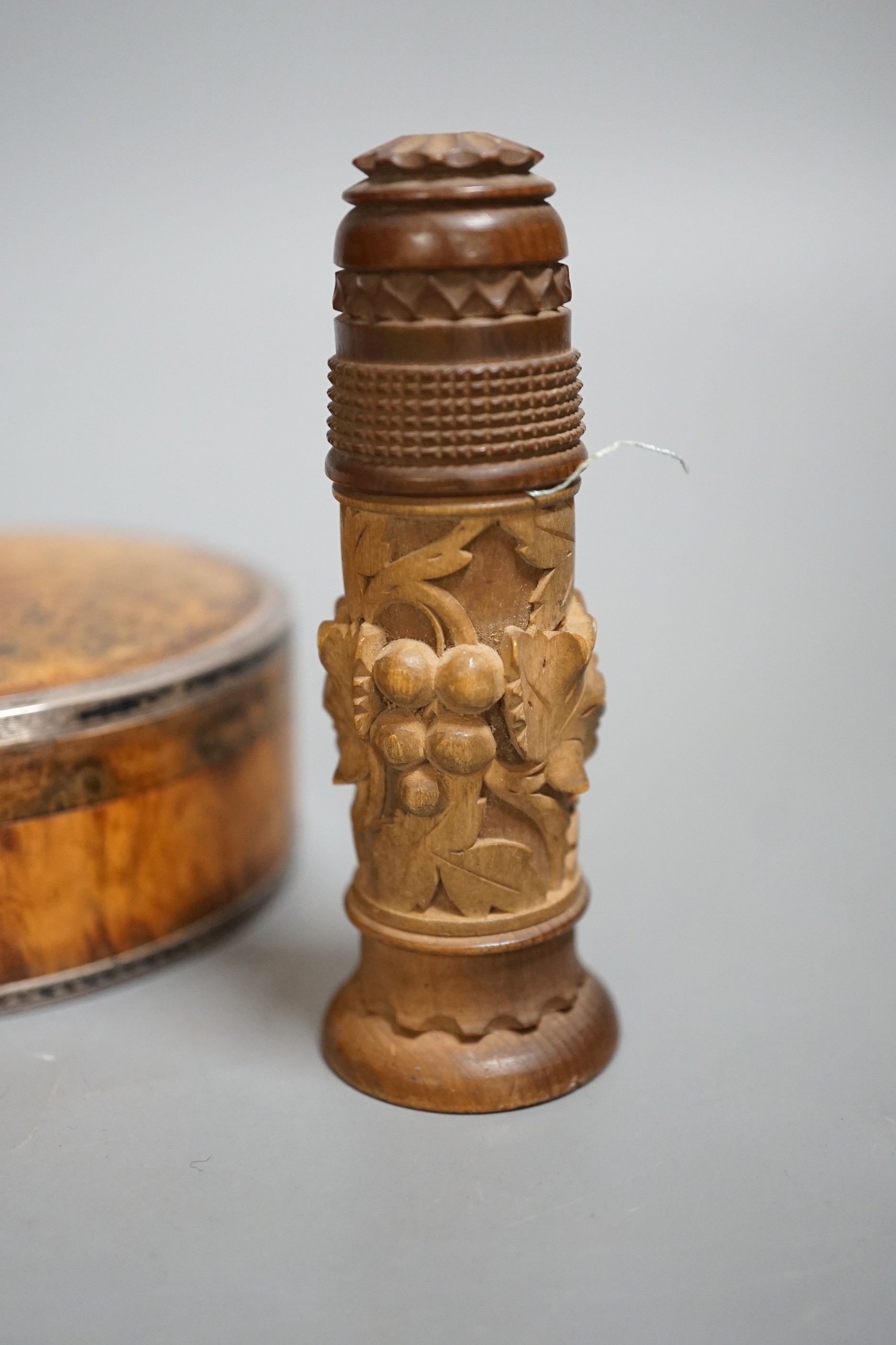 A 19th century circular white metal mounted burr wood snuff box and assorted small carvings